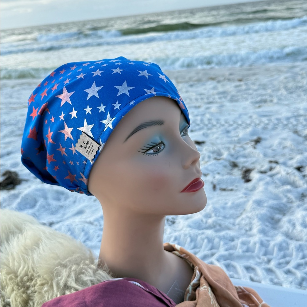 Red and silver stars on blue Spandex scrub cap.